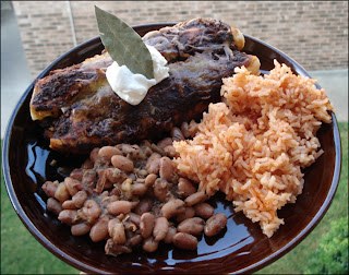 it's a feast! enchiladas, beans, and spanish rice.
